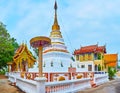 The picturesque white-golden stupa of Wat Sangkharam Temple, Lamphun, Thailand