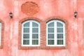 Picturesque window on red wall of house. Italy home style