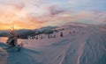 Picturesque winter alps sunrise. Highest ridge of the Ukrainian Carpathians is Chornohora with peaks of Hoverla and Petros