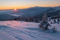 Picturesque winter alps sunrise. Highest ridge of the Ukrainian Carpathians is Chornohora with peaks Hoverla and Petros