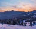 Picturesque winter alps sunrise. Highest ridge of the Ukrainian Carpathians is Chornohora with peaks of Hoverla and Petros