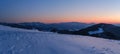 Picturesque winter alps sunrise. Panoramic mountains view from Svydovets ridge and Dragobrat ski resort