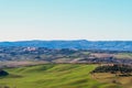 Picturesque winter landscape view of Tuscany with stone houses, colorful hills, fields and vineyards in Italy Royalty Free Stock Photo