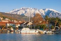 Picturesque winter Mediterranean landscape. Montenegro. View of Marina Kalimanj in Tivat city and  snow-capped mountains of Lovcen Royalty Free Stock Photo