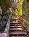 Picturesque wooden boardwalk and stairs on a hike through a canyon. Mono Cliffs Provincial Park