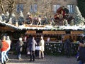 Picturesque wooden house with Santa Claus and his reindeer on the snowy roof. Suttrart, Germany. Royalty Free Stock Photo