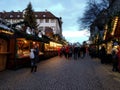 Picturesque wooden houses covered with Christmas lights and a big christmas tree in the streets of Stuttgart