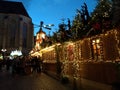 Picturesque wooden houses covered with Christmas lights and a big christmas tree in the streets of Stuttgart
