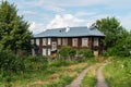 Yuryevets, Russia, July 5, 2023. Old log apartment building.