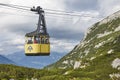 Picturesque yellow cable car in Dachstein mountain range. Austria
