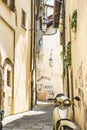 Picturesque yellow Tuscan street with a yellow scooter. Arezzo, Tuscany , Italy