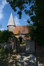 St Johns Church entrance and spire. Piddinghoe, East Sussex. UK