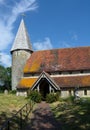 St Johns Church entrance and spire.. Piddinghoe, East Sussex. UK