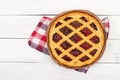 Pie with cherry jam on wooden background. Royalty Free Stock Photo