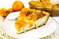 Pie with curd and persimmons in plate on napkin Royalty Free Stock Photo