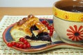 Pie with currant and tea