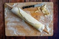 Pie Dough Wrapped Around a Wooden Rolling Pin Royalty Free Stock Photo