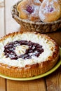 Pie and fruitcakes in plates on a table