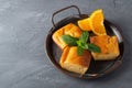 Pie, mint and orange on a metal tray