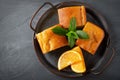 Pie, mint and orange on a metal tray