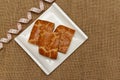 Pie parts on a ceramic plate and a centimeter tape