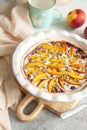 Pie with peach, blueberry and pumpkin seeds