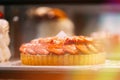 pie with strawberries, assortment baked pastry in bakery. Various Different Types Of Sweet Cakes In Pastry Shop Glass