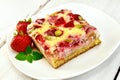 Pie strawberry-rhubarb with sour cream and berries on light boar Royalty Free Stock Photo