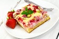 Pie strawberry-rhubarb with sour cream and fork on board Royalty Free Stock Photo