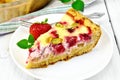 Pie strawberry-rhubarb with sour cream on light board Royalty Free Stock Photo