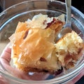 Piece of apple cake in a glass bowl