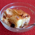 Piece of apple cake in a glass bowl