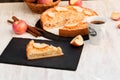 Piece of apple crumble cake, delicious apple pie and cup of black coffee on rustic white table Royalty Free Stock Photo