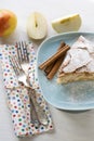 A piece of apple pie lying on blue plate, apple, cinnamon sticks Royalty Free Stock Photo