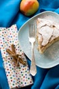 A piece of apple pie lying on blue plate, apple, cinnamon sticks Royalty Free Stock Photo