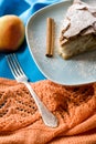 A piece of apple pie lying on blue plate, apple, cinnamon sticks Royalty Free Stock Photo