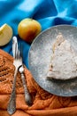 A piece of apple pie lying on blue plate, apple, cinnamon sticks Royalty Free Stock Photo