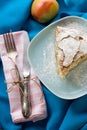 A piece of apple pie lying on blue plate, apple, fork Royalty Free Stock Photo