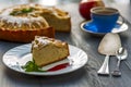 Piece of apple pie on plate with jam, tea cup Royalty Free Stock Photo