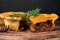 Piece of Australian meat pie with rosemary Royalty Free Stock Photo