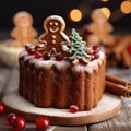 Piece of baked Christmas cake decorated with gingerbread men and cranberries