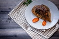 A large piece of baked meat Still life on a light wooden table Royalty Free Stock Photo