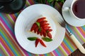 A piece of banana-strawberry sponge cake decorating with mint leaves Royalty Free Stock Photo