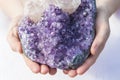 A piece of beautiful Amethyst in Hands Royalty Free Stock Photo