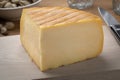 Piece of  Belgian Chimay a la biere cheese on a cutting board Royalty Free Stock Photo