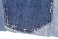 Piece of blue jeans fabric with ripped of back pocket Royalty Free Stock Photo