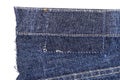 Piece of blue jeans fabric with ripped of back pocket Royalty Free Stock Photo