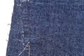 Piece of blue jeans fabric with ripped of back pocket Royalty Free Stock Photo