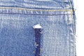 Piece of blue jeans fabric with ripped of back pocket Royalty Free Stock Photo