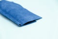 Piece of blue leather and suede cut on white background. Concept and idea of fine leather crafting, handmade, handcrafted